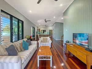 a living room with a couch and a tv at Debs Shed in Arcadia