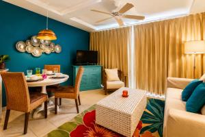 a living room with a table and a couch at Hawaiian Princess Beachfront 1BR in Waianae