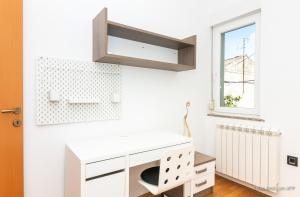 a white room with a desk and a window at Residence Almarea by Locap Group in Izola +55 photos