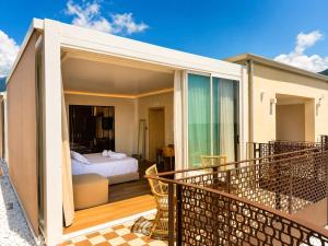 a room with a bed and a balcony with a bedroom at Beach Hotel Terracotta in Sapri +46 photos