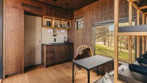 a kitchen and dining room of a tiny house at Goose in St. Andrews