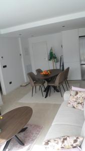 a living room with a table and chairs at Villa Ceesito in Los Alcázares