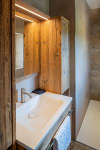 a bathroom with a sink and a mirror at steiRerBLiCke - Weinstöckl Steinbach in Steinbach