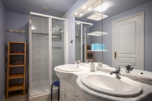 a white bathroom with two sinks and a shower at Chambres d'hôtes, Les Combes in Orbey +35 photos