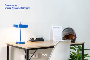 a desk with a helmet on top of it at weroomies - Pons Icar H3 in Tarragona +17 photos