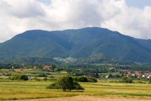 a mountain range with a town in the foreground at Apartman Rena in Ivanec
