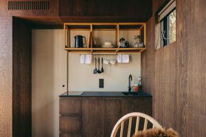 a kitchen with wooden cabinets and a counter top at Curlew in St. Andrews