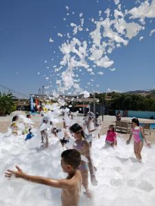 a group of people playing in the sand on the beach at Vel-Mer Lefke in Ayios Nikolaos +11 photos