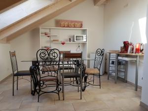 a dining room with a table and chairs at Double room 75 sqm between Augsburg and Munich in Wiedergeltingen