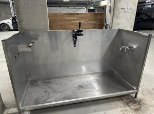 a steel tub with a faucet in a garage at Twintip Apartments in Åre +15 photos