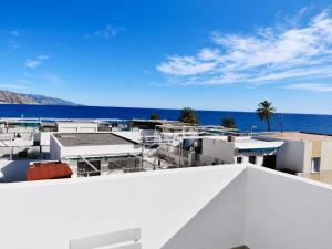 a view of the ocean from the roof of a building at Velez Nazari Cambriles in Lújar