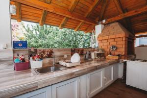 a kitchen with a sink and a counter top at Apartmani Saric A&K in Vir