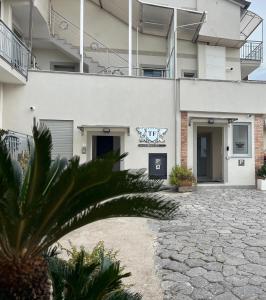 a building with a stone driveway in front of a building at Terraforte Luxury Suite in Fisciano