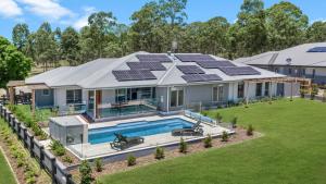 a house with solar panels on the roof at Kokoon in Pokolbin