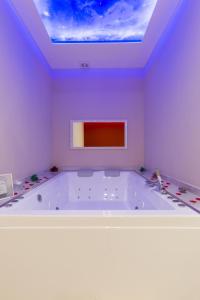 a large bath tub in a room with a ceiling at Terraforte Luxury Suite in Fisciano +44 photos