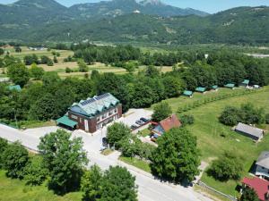 an aerial view of a house with a road and trees at Hotel Serdar in Mojkovac