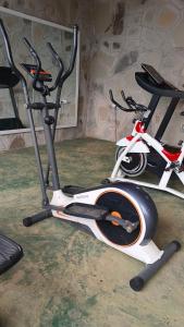 a gym with two exercise bikes in a room at Lesha Park Hotel in Libwezi