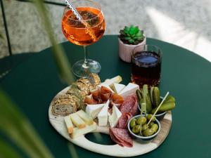 a plate of food on a table with a drink at ibis Brussels Centre Chatelain in Brussels