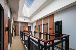 a balcony with a skylight in a building at Cove Good Friends in Busuk 1