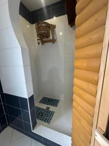 a bathroom with a shower with a basket in it at Арендное жилье Лиманка in Odesa +11 photos