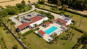 an aerial view of a house with a swimming pool at Luxury Home & Pool by Symphonya Luxury Holiday Rentals in Lequile