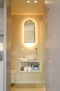a bathroom with a sink and a mirror at Oseraie Cabins - Wild lodges entre Liège et Maastricht in Visé +58 photos