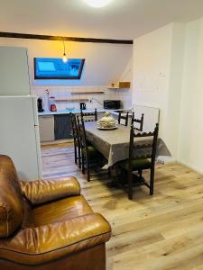 a kitchen and dining room with a table and chairs at Albergue Bosquet in Brussels