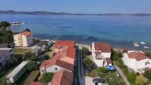 an aerial view of a town and the water at Mermaid Cove in Sukošan