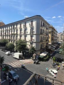 a large building with cars parked in a parking lot at Coremi Naples in Naples +6 photos