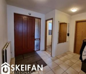 a room with a wooden door and a tile floor at Great place to see the solar eclipse! in Patreksfjörður