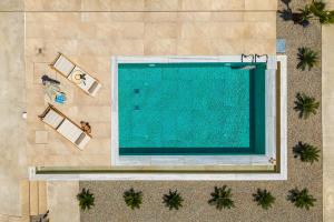 an overhead view of a swimming pool in a resort at Paradise Garden Villa in Moírai