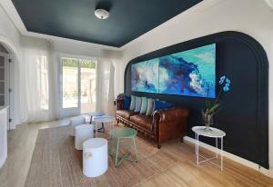 a living room with a couch and a large flat screen tv at Suite con Vista a las Islas Cies in Vigo