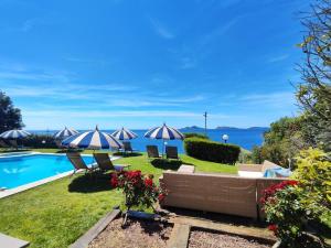 a villa with a pool and a view of the ocean at Suite con Vista a las Islas Cies in Vigo