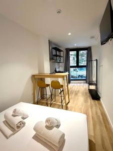 a bedroom with a bed with two towels on it at Hotelito Boutique Madrid Auditorio in Madrid