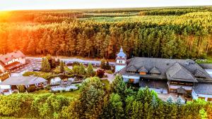 an aerial view of a resort with a large building at Resort Pod Lasem in Kolonowskie