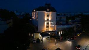 a lit up building at night in a city at Danube Hotel & Spa in Silistra