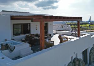 a balcony with a hot tub on a house at Ktima Lipsi, Panorama Pool Views in Klouvas