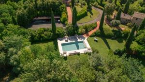 an aerial view of a house with a swimming pool at Podere Fignano, holiday home - apartments renovated 2024 - new swimming pool in Montaione