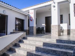 a set of stairs leading to a house at Queens Cove in Lüderitz