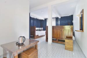 a bathroom with a sink and a tub in a room at Why Not Guest House, Ella in Ella