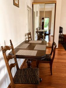 a table and chairs in a room with a dining room at Nostalgia in Sokolniki +57 photos
