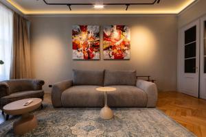 a living room with a couch and a table at Casa Di Paolo in Sibiu +291 photos