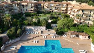an aerial view of a resort with a swimming pool at Apparthotel Saint Tropez centre in Saint-Tropez
