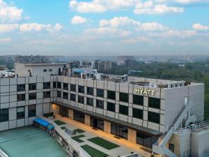 a building with a sign on the top of it at Hyatt Raipur in Raipur