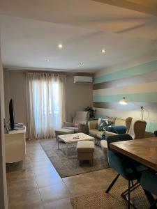 a living room with a couch and a table at Duplex Jalama II in Moraleja