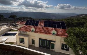 a roof with solar panels on top of a building at Villa K تلة الصنوبر in Ḩāşbayyā +2 photos