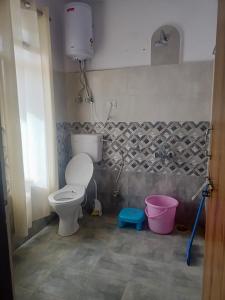 a bathroom with a toilet and a sink at The Dupchen Cave View in Kaja