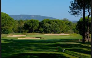 a view of a golf course with a green at Casa Serra & Mar in Azeitao