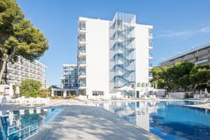 a hotel with a swimming pool in front of a building at Inter 2 in Salou +44 photos