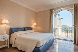 Postel nebo postele na pokoji v ubytování Collina Degli Ulivi B&B